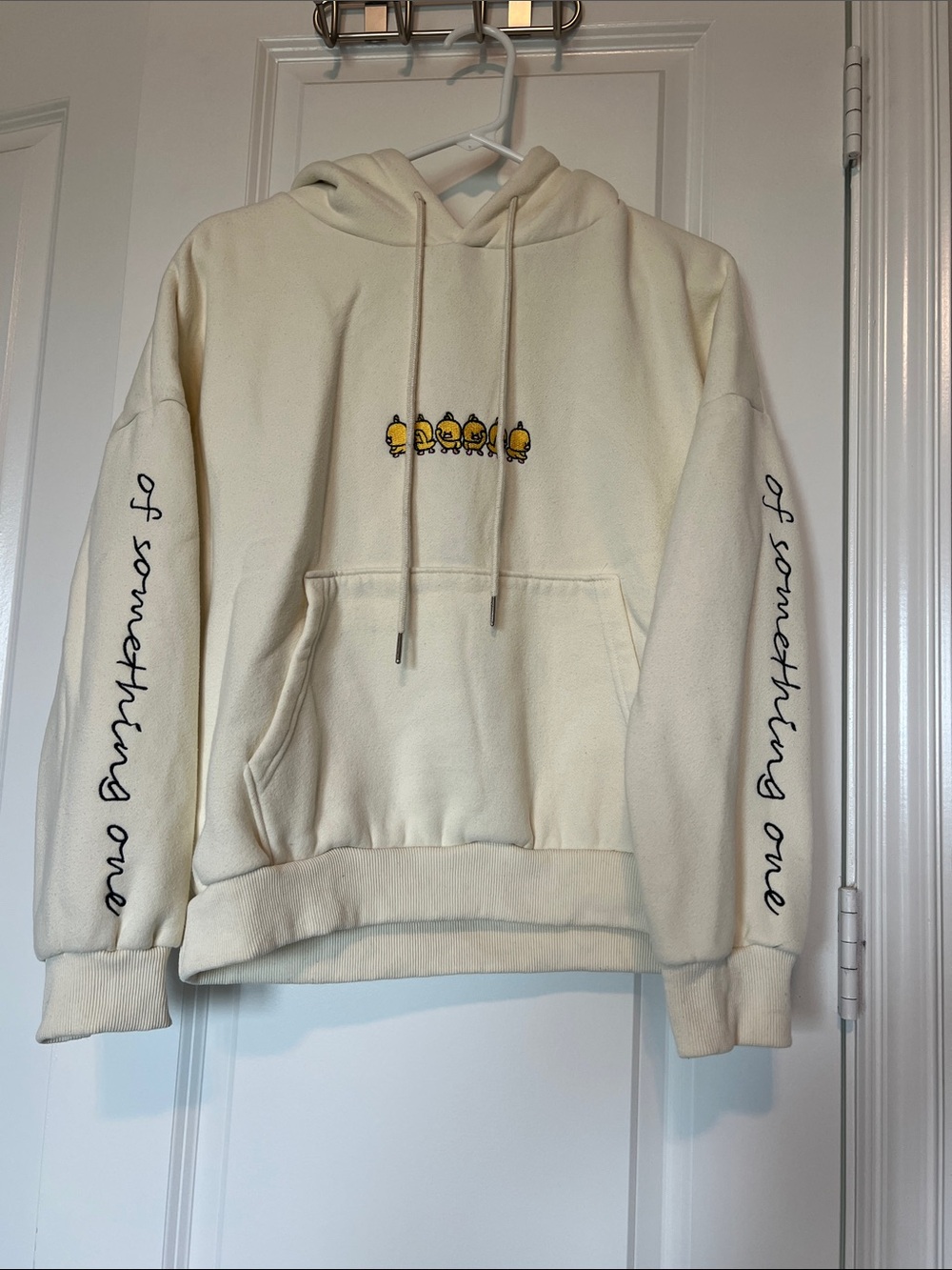 Cream Graphic Hoodie Sweatshirt with Embroidered Chick Motif